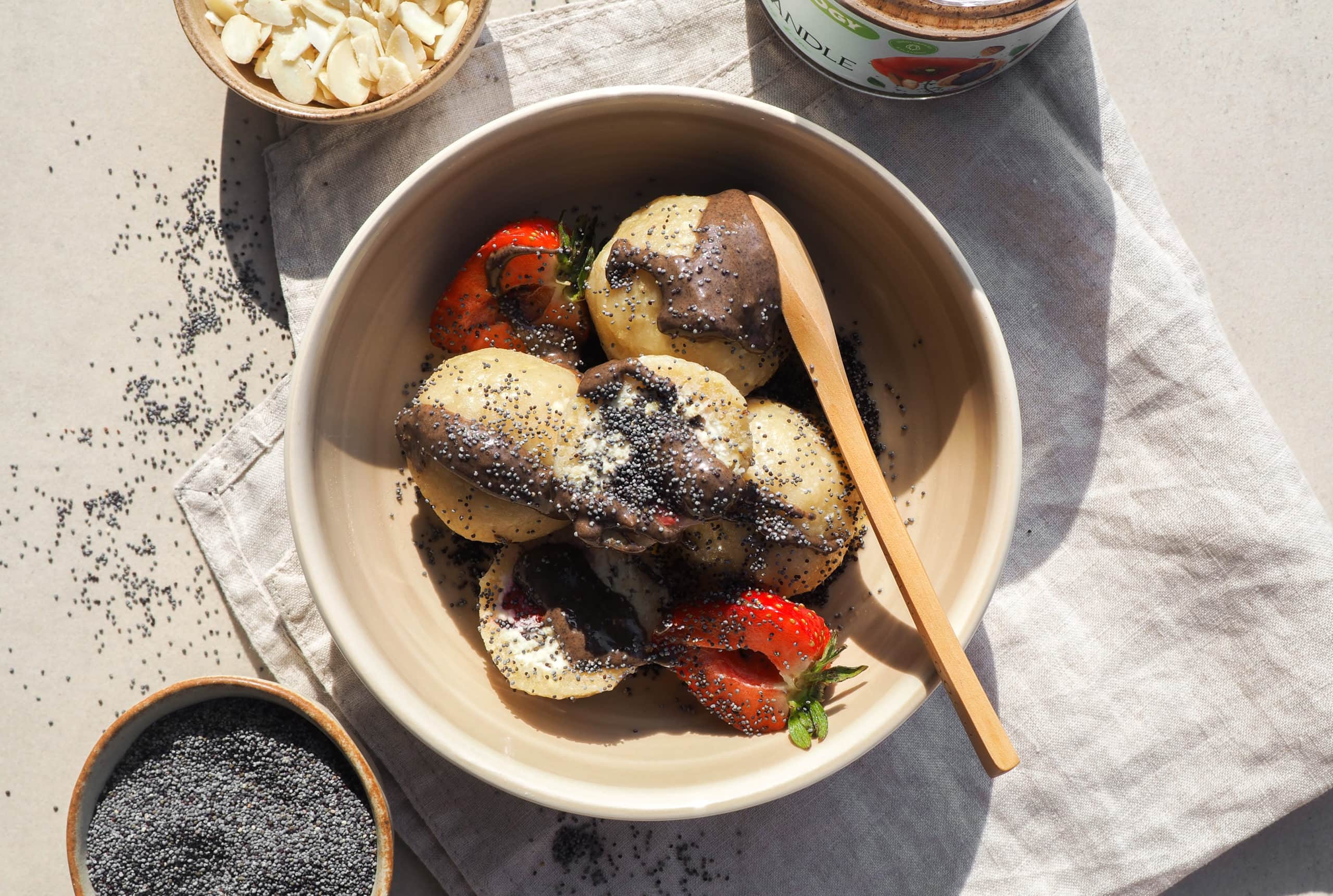 Poppy seed balls filled with strawberries